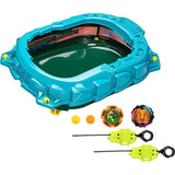 Arène QuadStrike Light Ignite turquoise présentée avec deux toupies, deux lanceurs et leurs accessoires